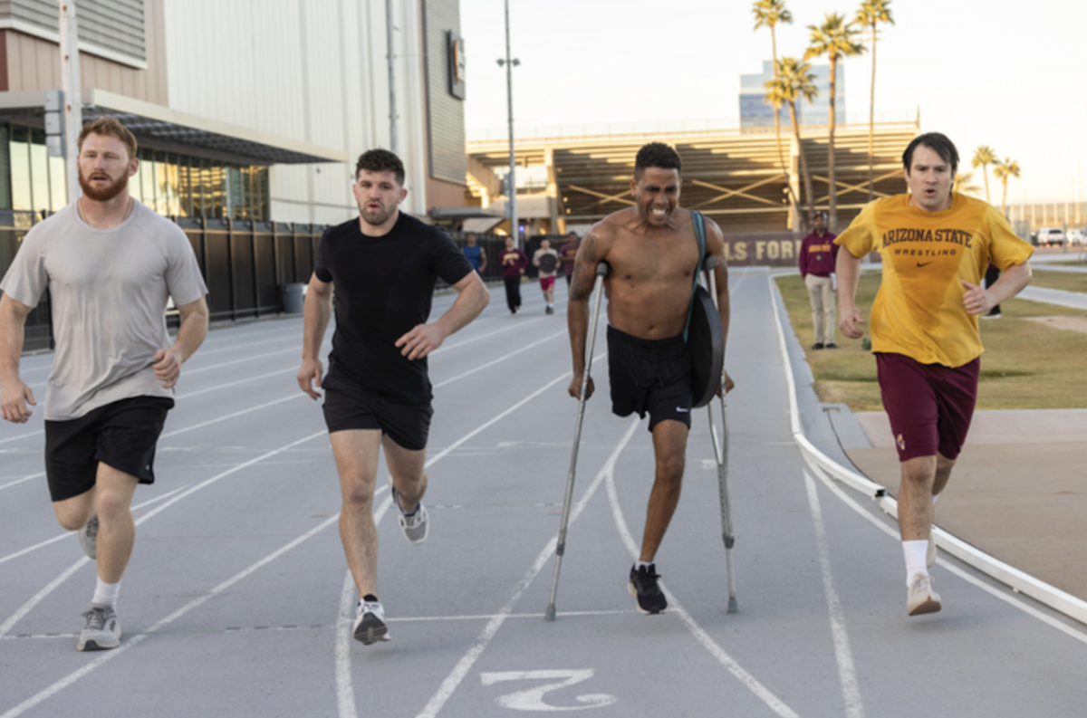 Quatre hommes font du demi fond, dont Jharrel Jerome qui joue le rôle d'Anthony Robles